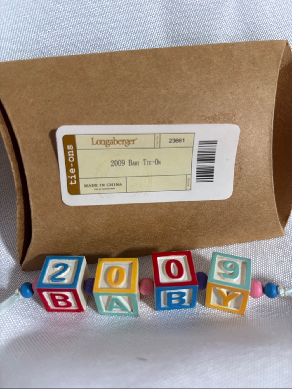 Longaberger Baby Tie-On in Multicolor (2009)